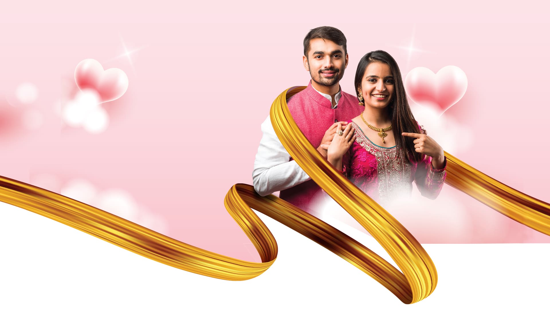 A man and woman in Indian traditional dress and smiling